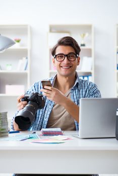 Young photographer working with his camera