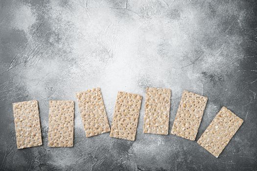 Buckwheat crisp bread set, on gray stone table background, top view flat lay, with copy space for text