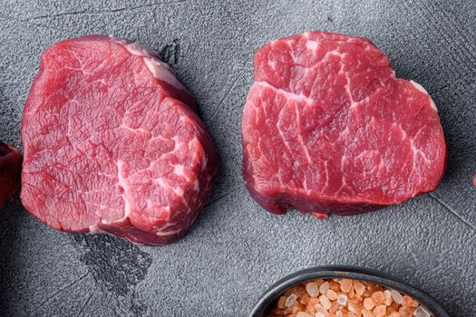 Prime Raw Fillet Mignon tenderloin steaks set, on gray stone background, top view flat lay