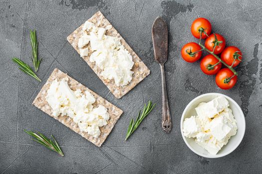 Homemade Crisp bread toast with Cottage Cheese set, on gray stone table background, top view flat lay