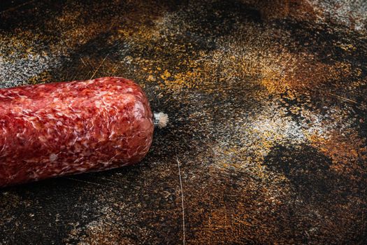 Delicious salami sausage set, on old dark rustic background, with copy space for text