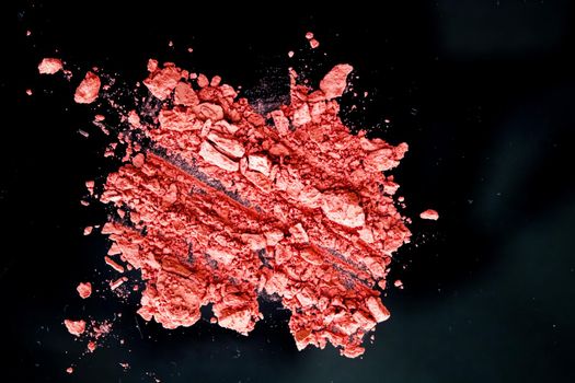 Crushed cosmetics, mineral organic eyeshadow, blush and cosmetic powder isolated on black background, makeup and beauty banner, flatlay design.