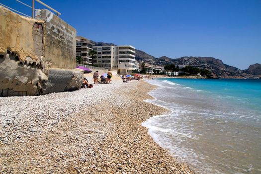 Beautiful Cap Negret beach on a sunny day of Spring in Altea, Alicante, Spain