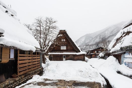 Shirakawago village with snow fall in winter season . Landmark of Gifu , Takayama , Japan .