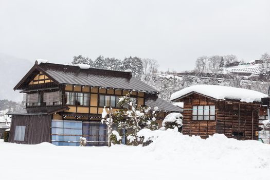 Shirakawago village with snow fall in winter season . Landmark of Gifu , Takayama , Japan .