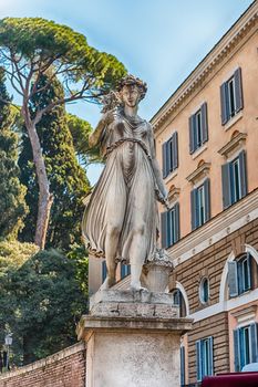 Statue in the iconic Piazza del Popolo, one of the main squares and landmarks in Rome, Italy