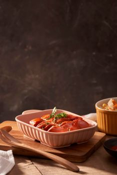 Grilled sausages with sauce ketchup on a wooden table