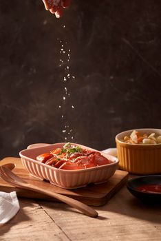 Grilled sausages with sauce ketchup on a wooden table