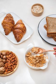 Health and colorful breakfast - waffles, muffins, almond, hazelnuts, various fresh fruits on table. Health food concept .Top view.