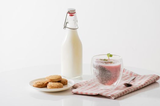 Chia pudding with yogurt and berries in glass