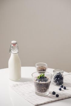 Chia pudding with fresh berries and almond milk. Superfood concept. Vegan, vegetarian and healthy eating diet with organic products