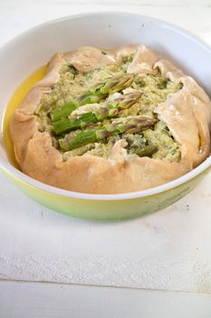 Vegan savory pie made with spelled flour and asparagus cream 