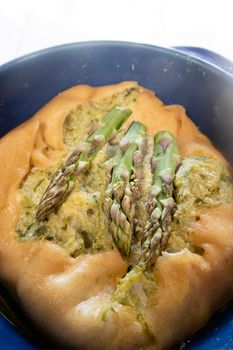 Vegan savory pie made with spelled flour and asparagus cream 