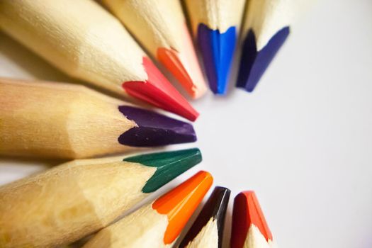 Colored pencils arange in a half circle