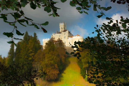 Medieval castle and lake reflection of Trakoscan, Croatia. Castle is settled on north west part of Croatia.