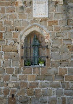 Muggia, Italy. June 13, 2021.  a small statue of St. Francis on the external facade of the homonymous church