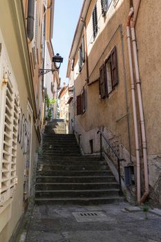 Muggia, Italy. June 13, 2021.  a narrow staircase between the streets of the historic center of the town