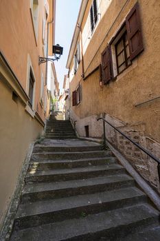 Muggia, Italy. June 13, 2021.  a narrow staircase between the streets of the historic center of the town