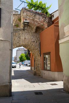 Muggia, Italy. June 13, 2021 the old city gate at the entrance to the historic center of the town