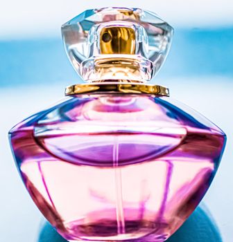 Perfume bottle on glossy background, sweet floral scent, glamour fragrance and eau de parfum as holiday gift and luxury beauty cosmetics brand design.