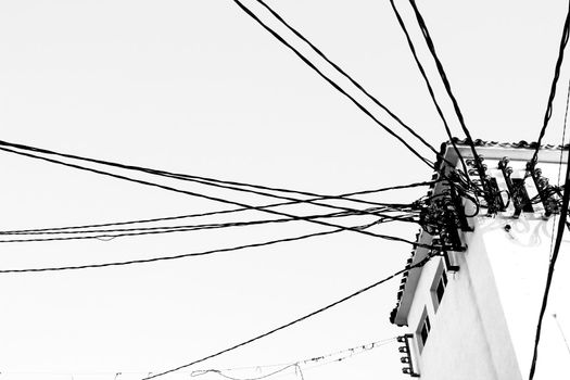 White high voltage cable distribution tower in Altea. Monochrome picture
