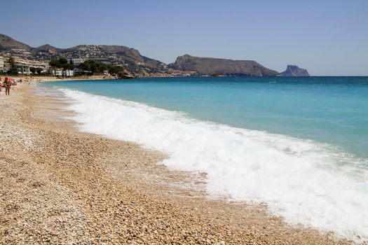 Beautiful Cap Negret beach on a sunny day of Spring in Altea, Alicante, Spain