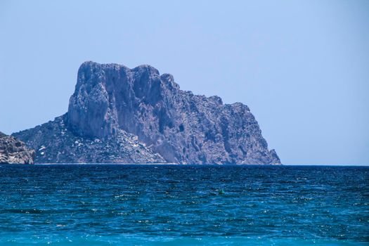 Beautiful Cap Negret beach and rock of Calpe in the background on a sunny day of Spring in Altea, Alicante, Spain