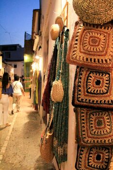 Altea, Alicante, Spain- June 12, 2021: People shopping at Handicraft and clothing store in Altea village, Spain