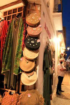 Altea, Alicante, Spain- June 12, 2021: People shopping at Handicraft and clothing store in Altea village, Spain