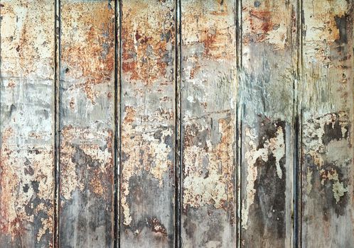 Wooden panels with peeling and worn paint