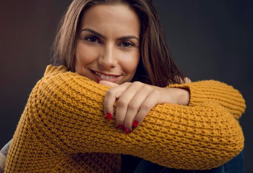 Shot of a beautiful young woman looking to the camera and smiling