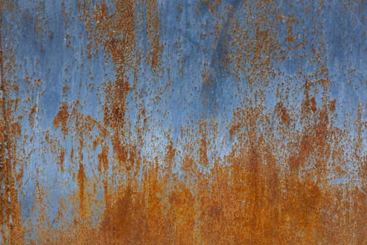 rusted flat solid sheet metal background and texture with leftovers of light-blue paint