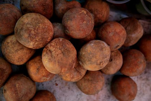 salvador, bahia, brazil - june 18, 2021: genipapo fruit is seen for sale at a free fair in the city of Salvador.