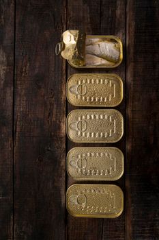 Series of boxes for storage containing sardines in olive oil