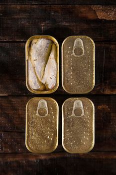 Series of boxes for storage containing sardines in olive oil