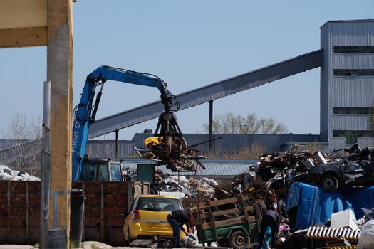 Ruse, Bulgaria - April, 09, 2021: old cars are disposed of on the basis of metal waste