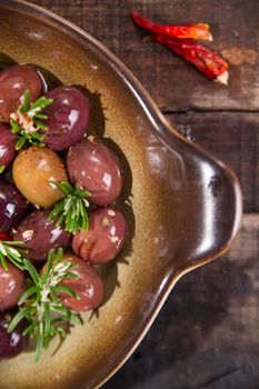 Italian food, snack of olives in brine presented in flat