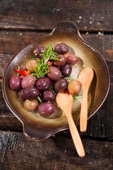 Italian food, snack of olives in brine presented in flat