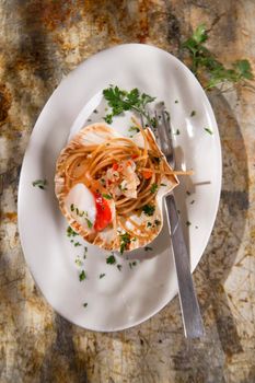 First dish with spaghetti integral to scallops and parsley