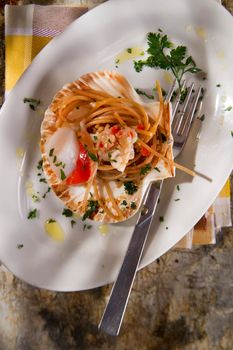 First dish with spaghetti integral to scallops and parsley