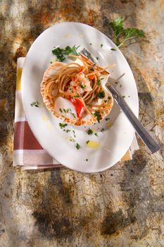 First dish with spaghetti integral to scallops and parsley