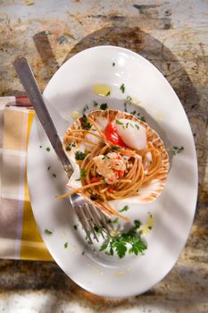 First dish with spaghetti integral to scallops and parsley