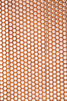 Background composed with perforated metal sheet and in an advanced oxidation state