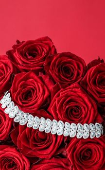 Gemstone jewellery, wedding fashion and luxe shopping concept - Luxury diamond bracelet and bouquet of red roses, jewelry love gift on Valentines Day and romantic holidays present