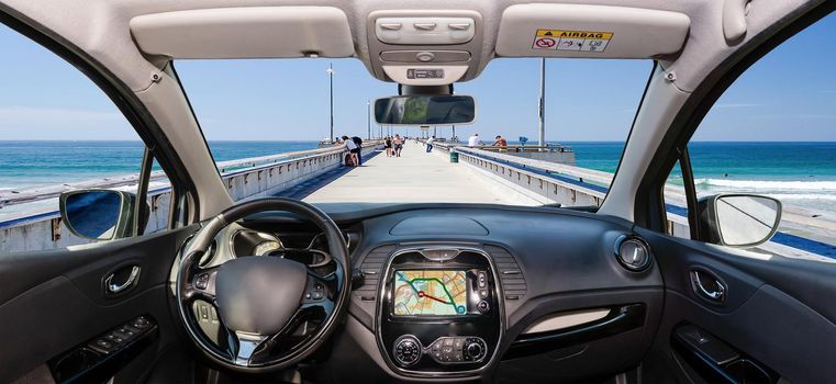 Looking through a car windshield with view over Venice Beach Pier, Los Angeles, California, USA