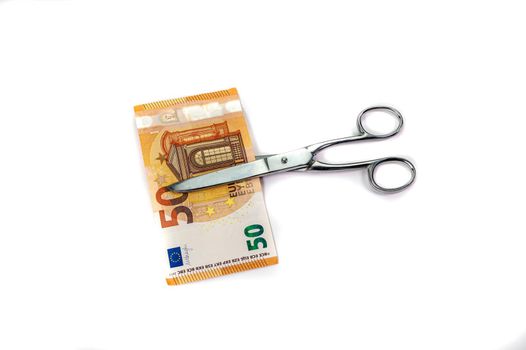 cut 50 euro banknotes with scissors on white background