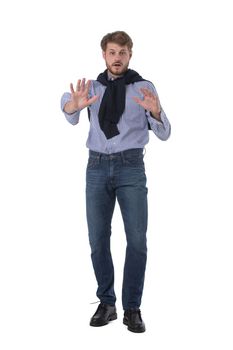 Young man with repelling gesture ni stop sign. Full length portrait isolated on white background