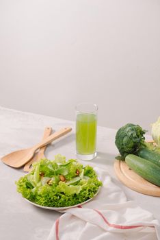 Various green organic salad ingredients on white background. Healthy lifestyle or detox diet food concept