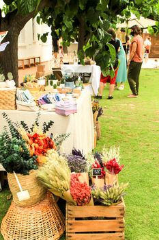 Elche, Alicante, Spain- June 19, 2021: Beautiful bouquets of dry flowers for sale at a market stall in Spain