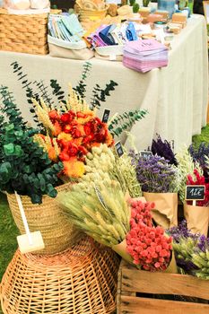 Elche, Alicante, Spain- June 19, 2021: Beautiful bouquets of dry flowers for sale at a market stall in Spain